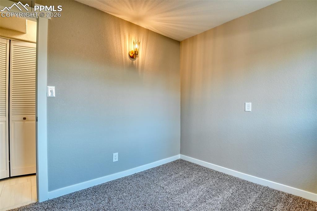 Spare room with carpet floors and baseboards