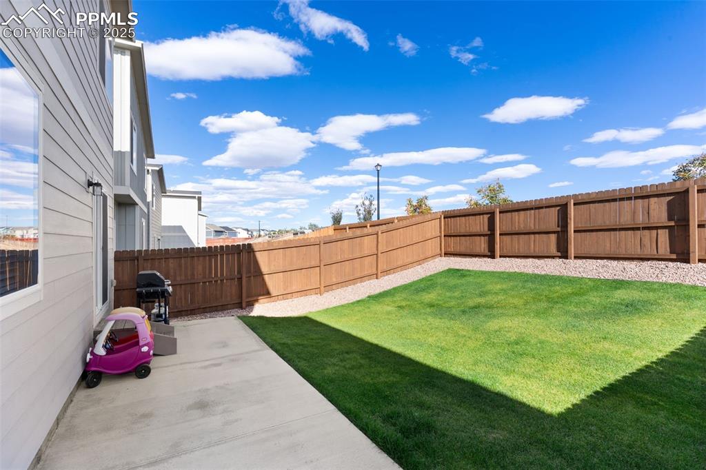 Fenced backyard featuring a patio area