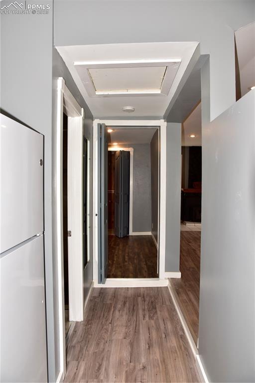 Hallway featuring wood finished floors