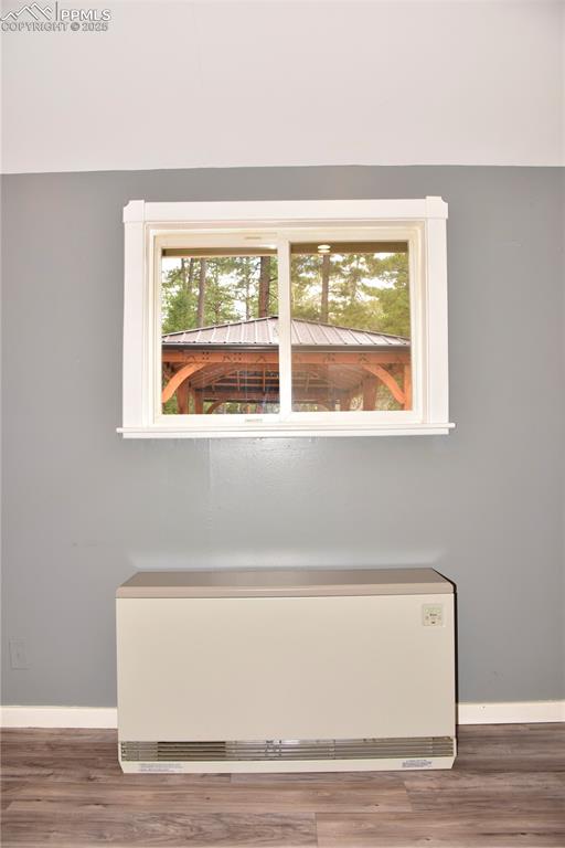 Detailed view of baseboards and wood finished floors