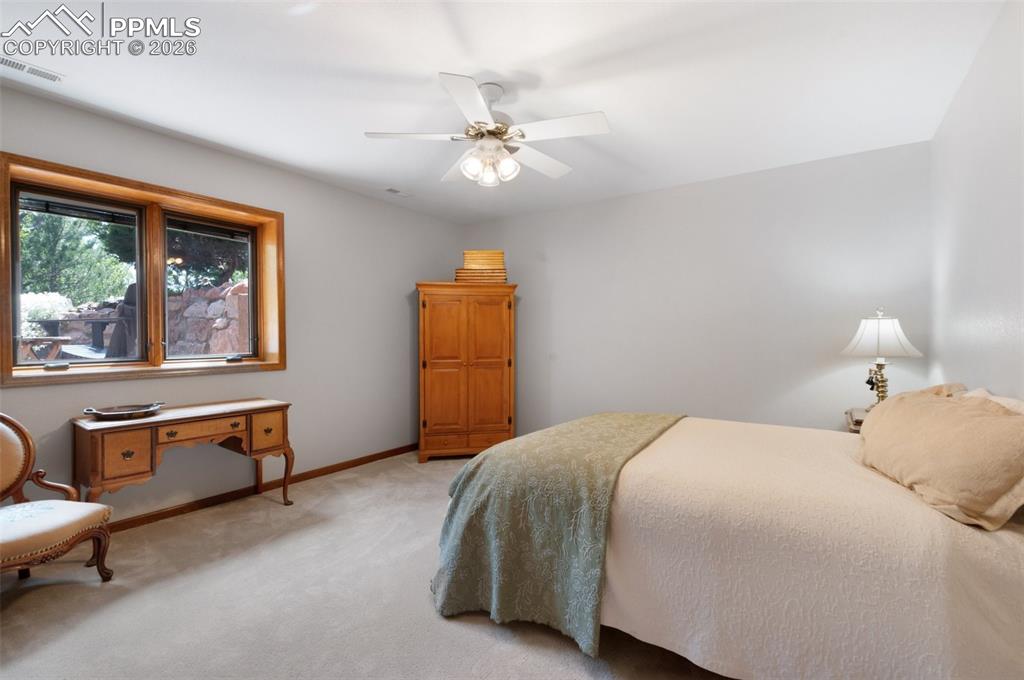Garden Level Window In Bedroom 4 Looks Out To Sitting Area...