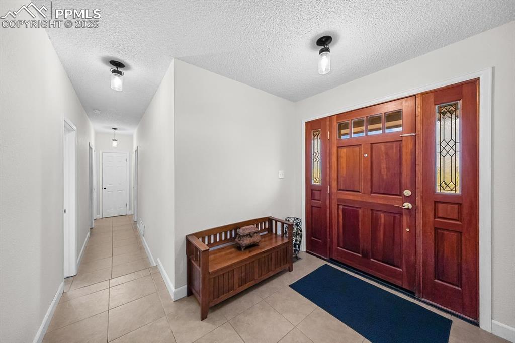 Entrance foyer with tile floors 