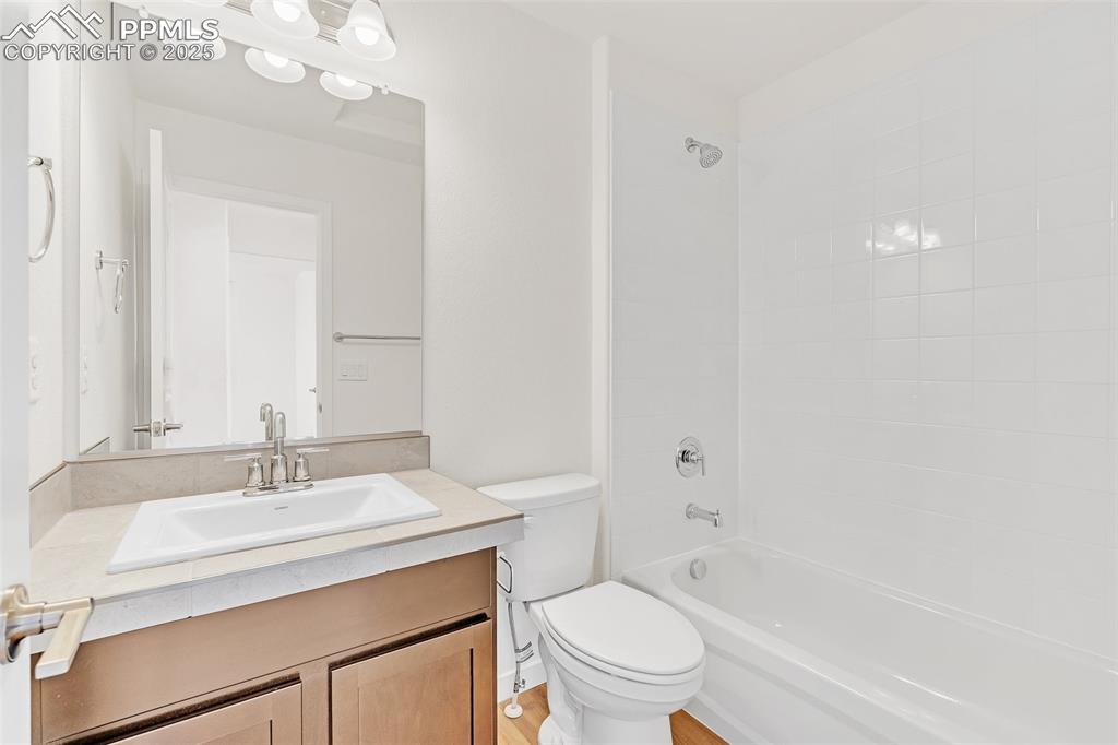 Full bathroom with shower / bathtub combination and vanity
