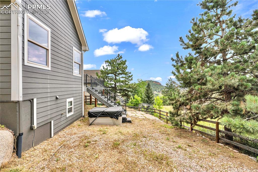 View of yard with stairs and a mountain view