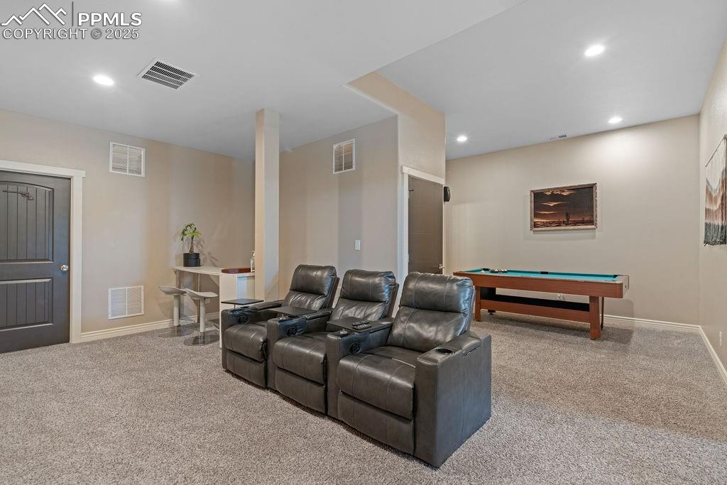 Cinema room featuring billiards, light colored carpet, and recessed lighting