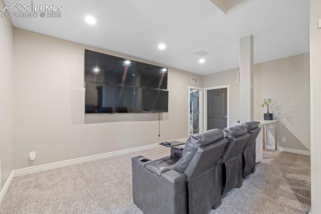 Home theater room featuring carpet flooring and recessed lighting