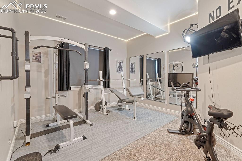 Exercise area featuring recessed lighting
