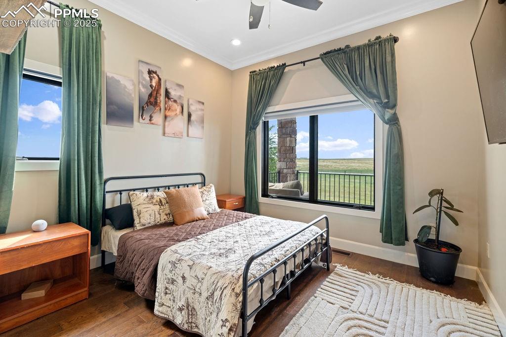 Bedroom featuring wood finished floors, ornamental molding, recessed lighting, and a ceiling fan
