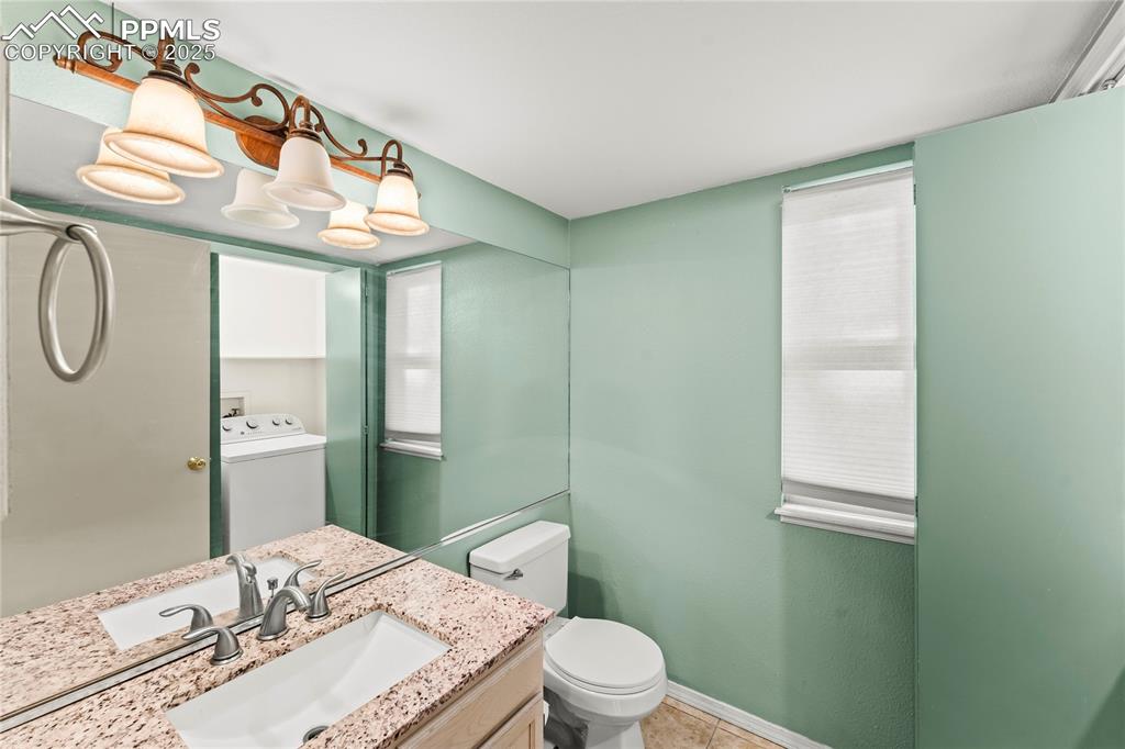 Main level half bath and laundry room