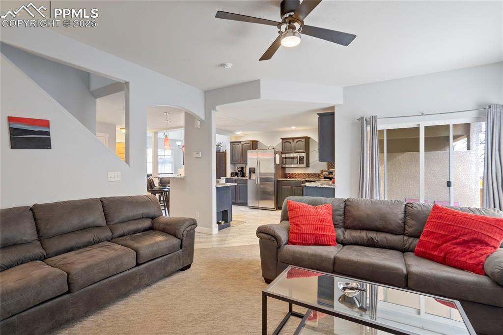 Living room featuring a ceiling fan