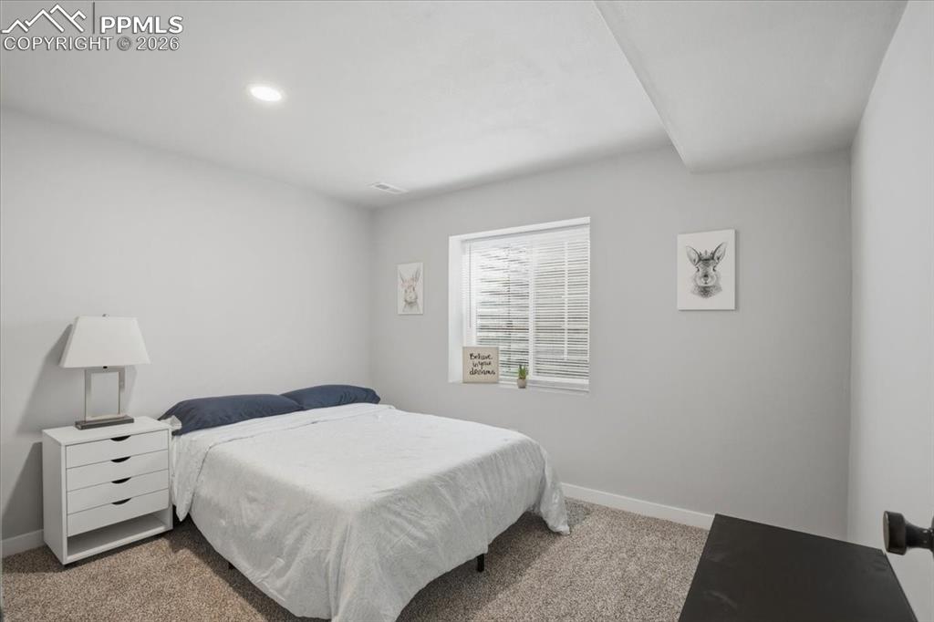 Right basement bedroom lwith spacious closet ocated near the finished lower level living area and full bathroom 