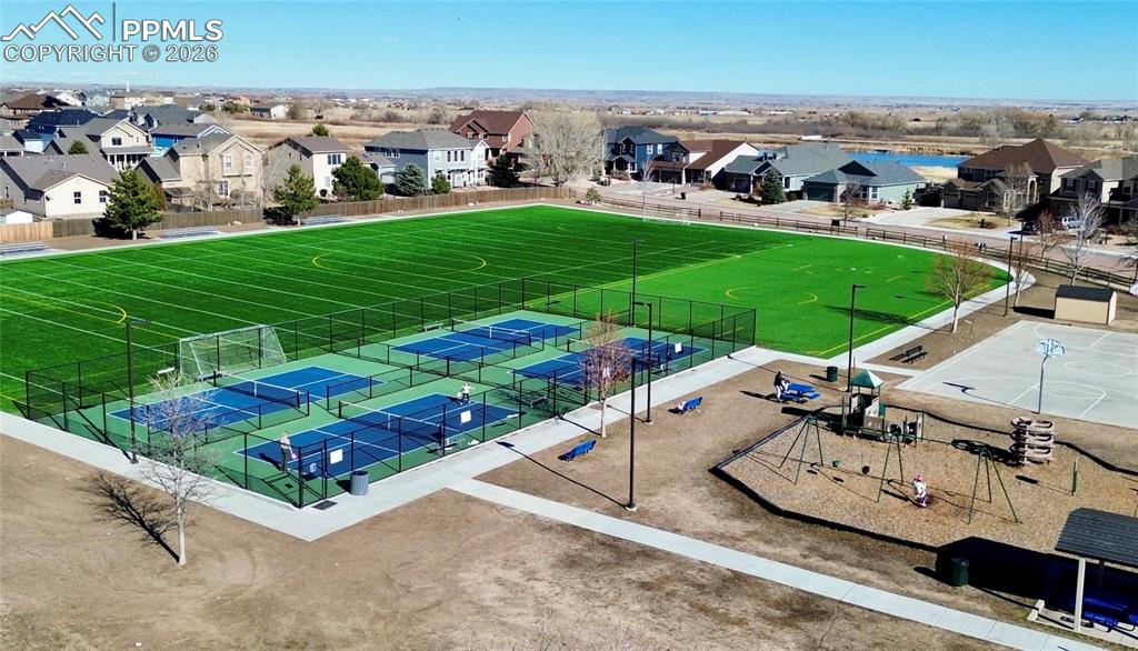 Nearby public park featuring football fields, playground, and pickleball courts less than one mile from the property 