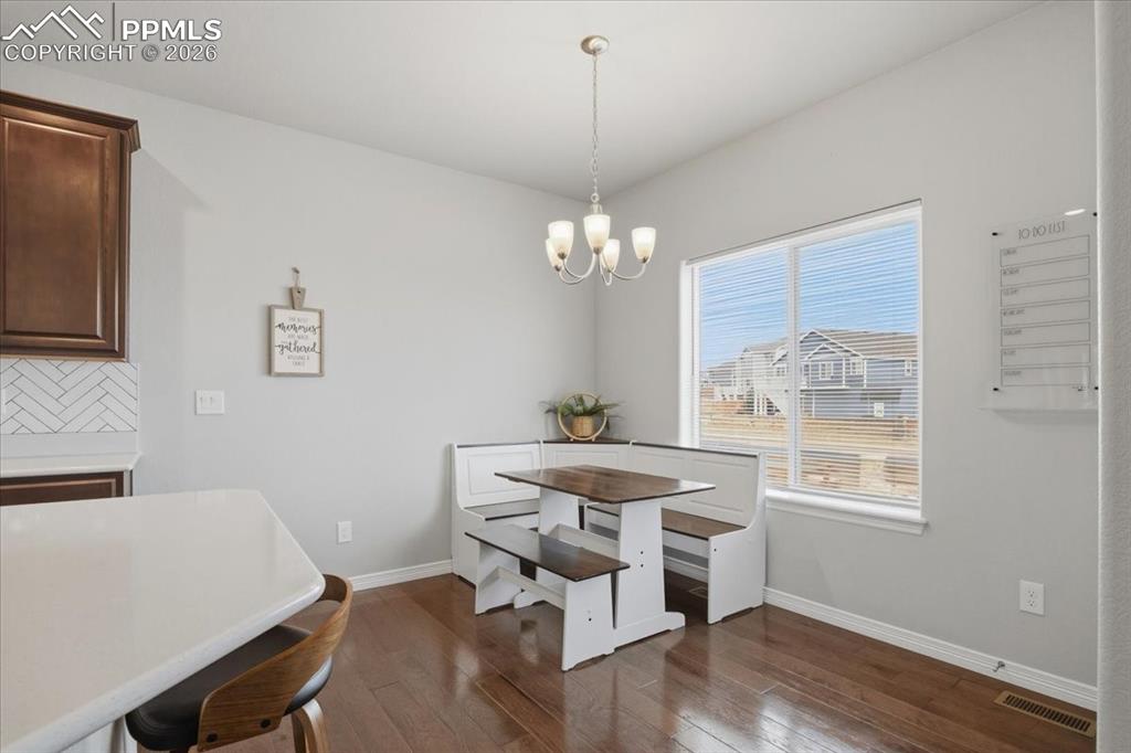 Dining area with backyard views and convenient access to outdoor living space