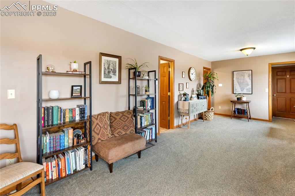 The sitting room has a rich wood trim framing the room!
