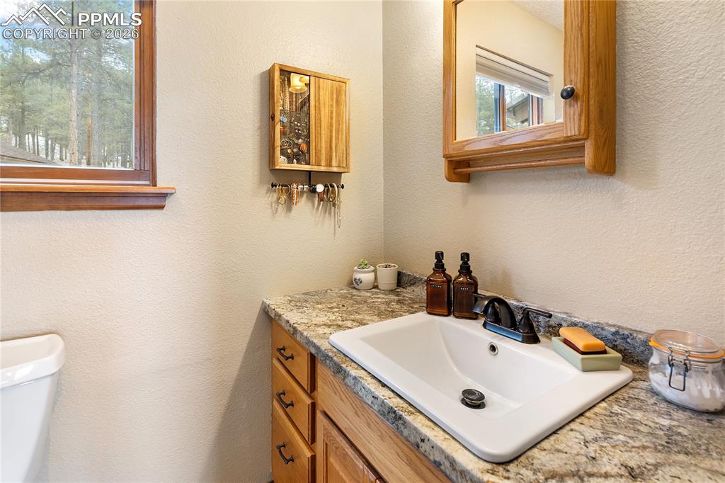 The 3/4 bathroom features a window for natural light, a medicine cabinet, and a vanity with storage drawers!
