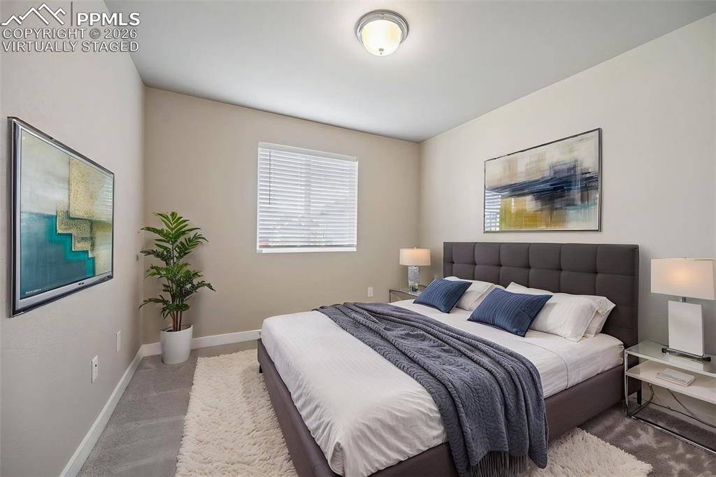 Virtually staged Secondary bedroom on main floor