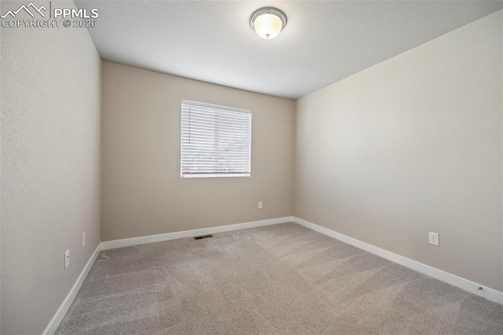 Unstaged secondary bedroom on main floor 