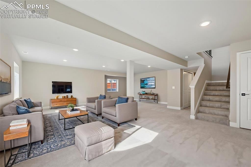 Virtually staged fully finished basement with 2 additional bedrooms and 1 full bathroom 