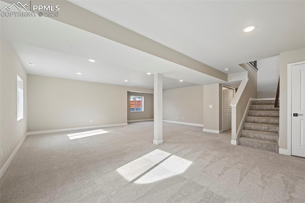 Unstaged fully finished basement with 2 additional bedrooms and 1 full bathroom 