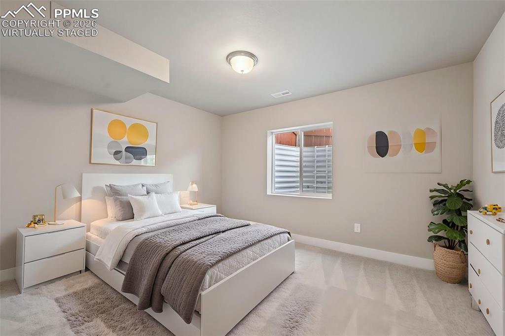 Virtually staged bedroom in basement 