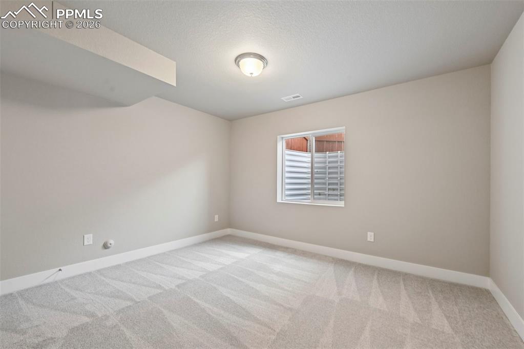 Unstaged bedroom in basement 