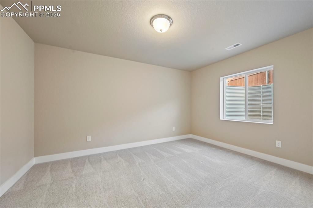 Unstaged bedroom in basement 