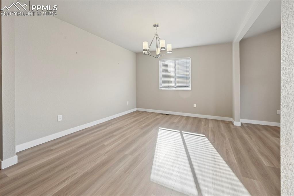 Unstaged formal dining room, can be used as office! 