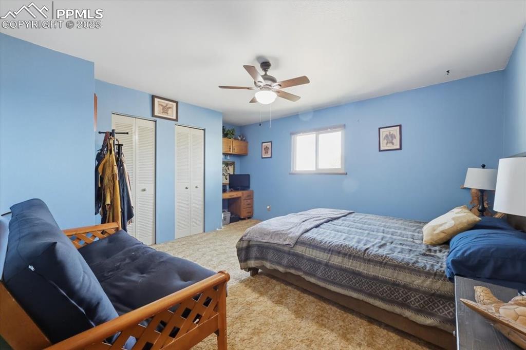 Main floor bedroom #2 with dual closets and built in desk area