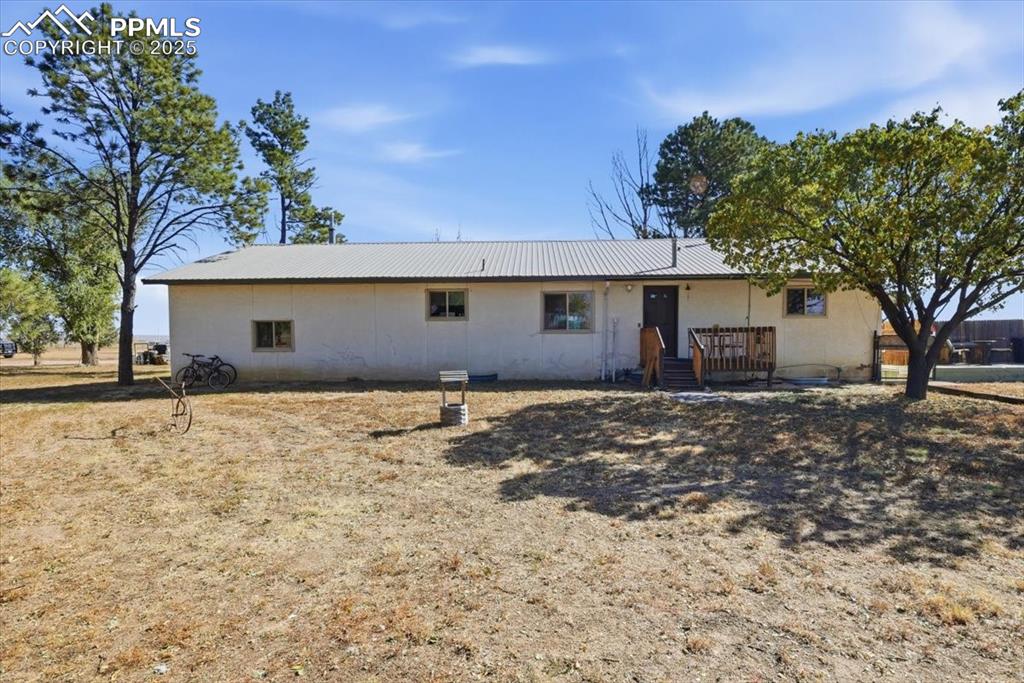 Back of house featuring a deck