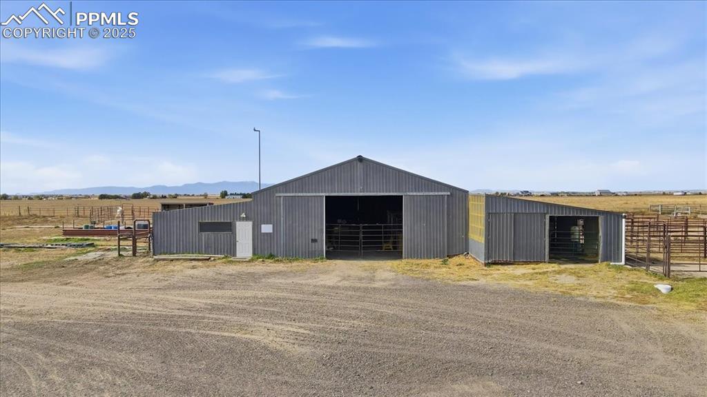 Barn with 10 indoor stalls with outside runs,  5 stalls in the center barn and a training arena, first aid/break area, and 2 quarantine stalls