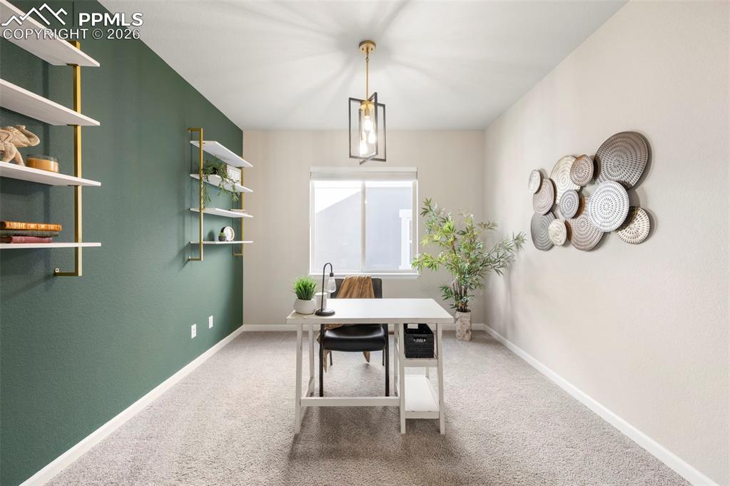 Office featuring baseboards and light carpet