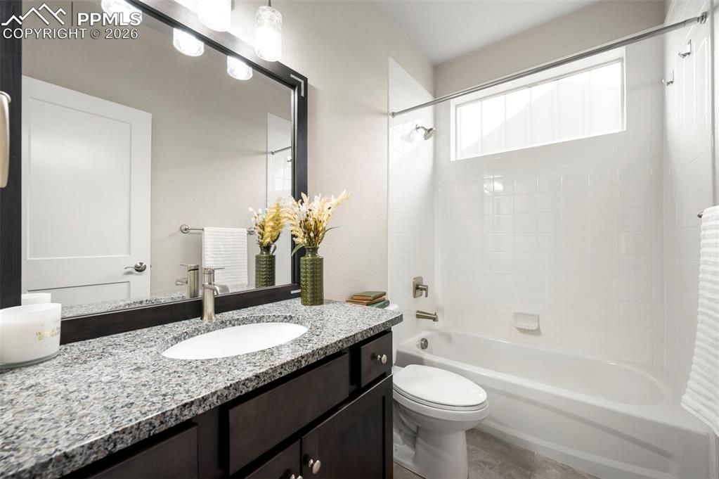 Bathroom with vanity and shower / bathtub combination