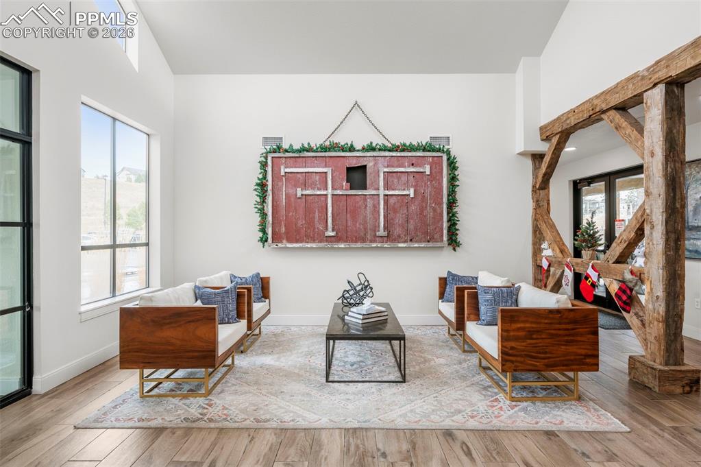 Living area with wood-type flooring and baseboards