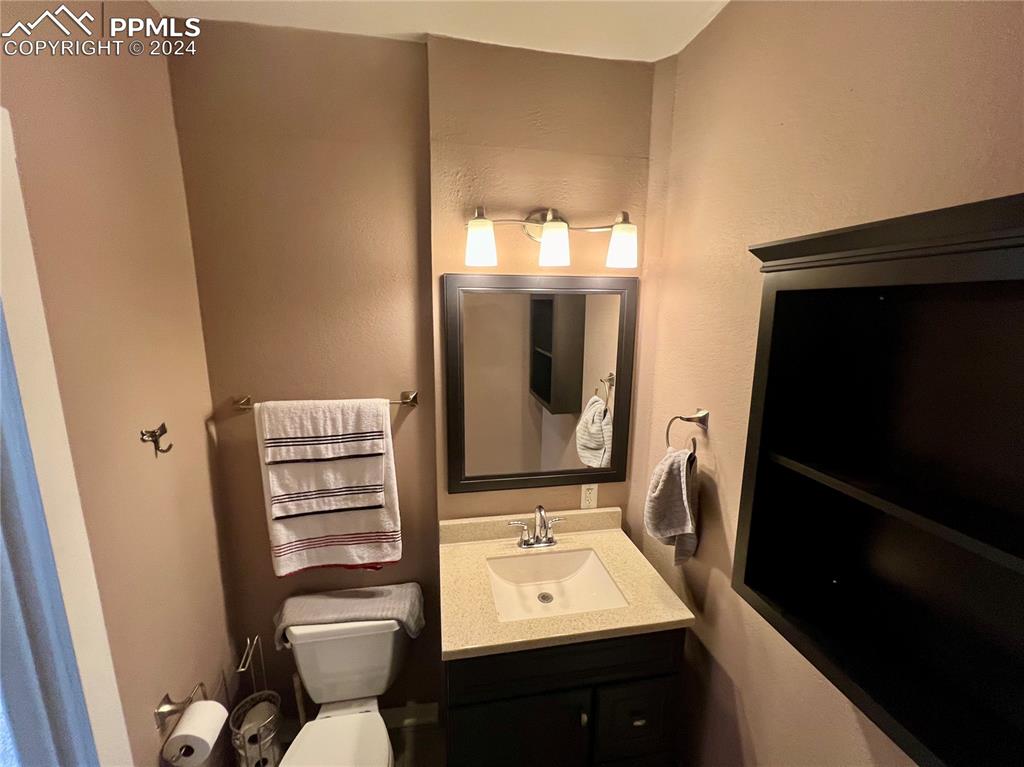 Bathroom with toilet and vanity