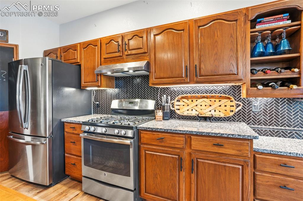 Undermount lighting and herringbone tile add class to this kitchen space.  