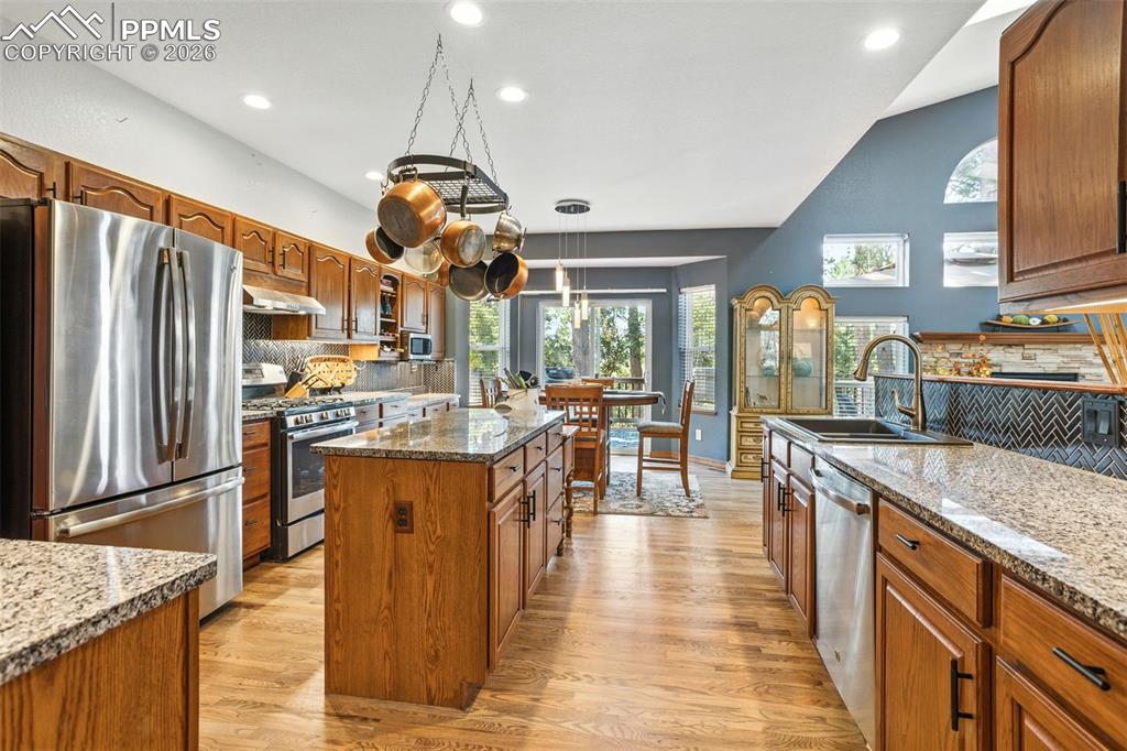 Chefs will delight w/all the granite countertops and island prep space.