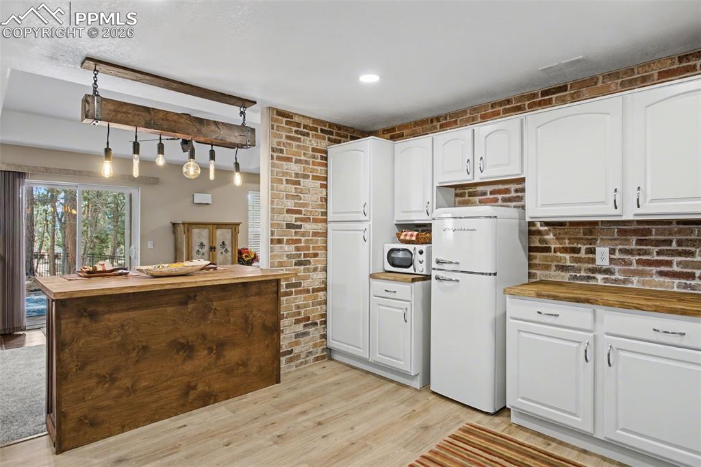 Island lighting in new kitchenette is quirky fun.  