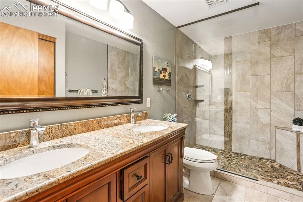 Lower level bath (#3) w/spa-like shower & double sinks w/granite counters