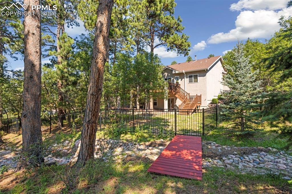 Dry creek bed runs through the rest of the backyard.  No trolls living under this bridge!