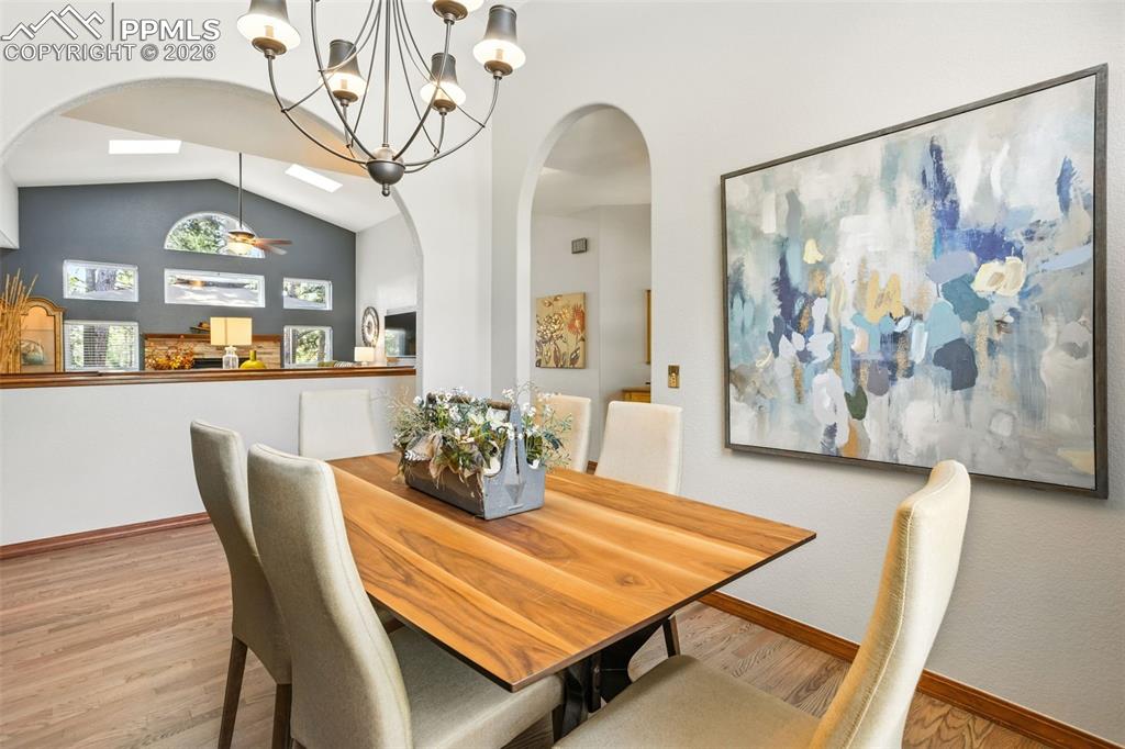 Arched doorways carry thru the dining & living room spaces