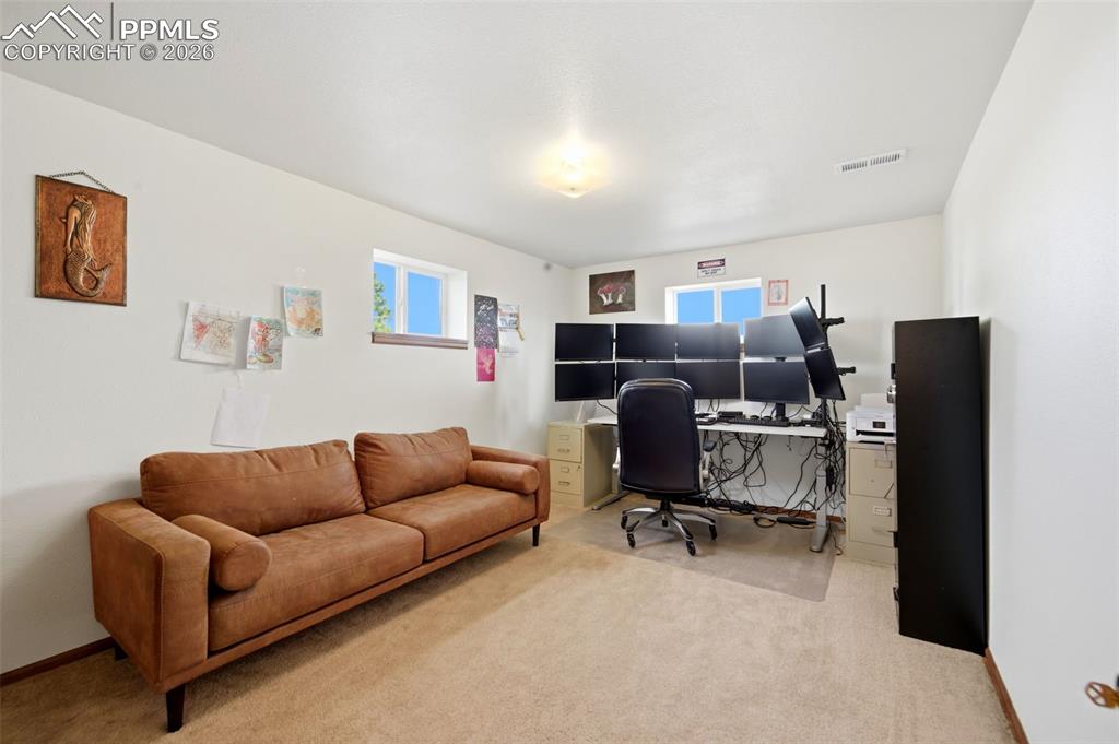 Office area with light colored carpet and plenty of natural light