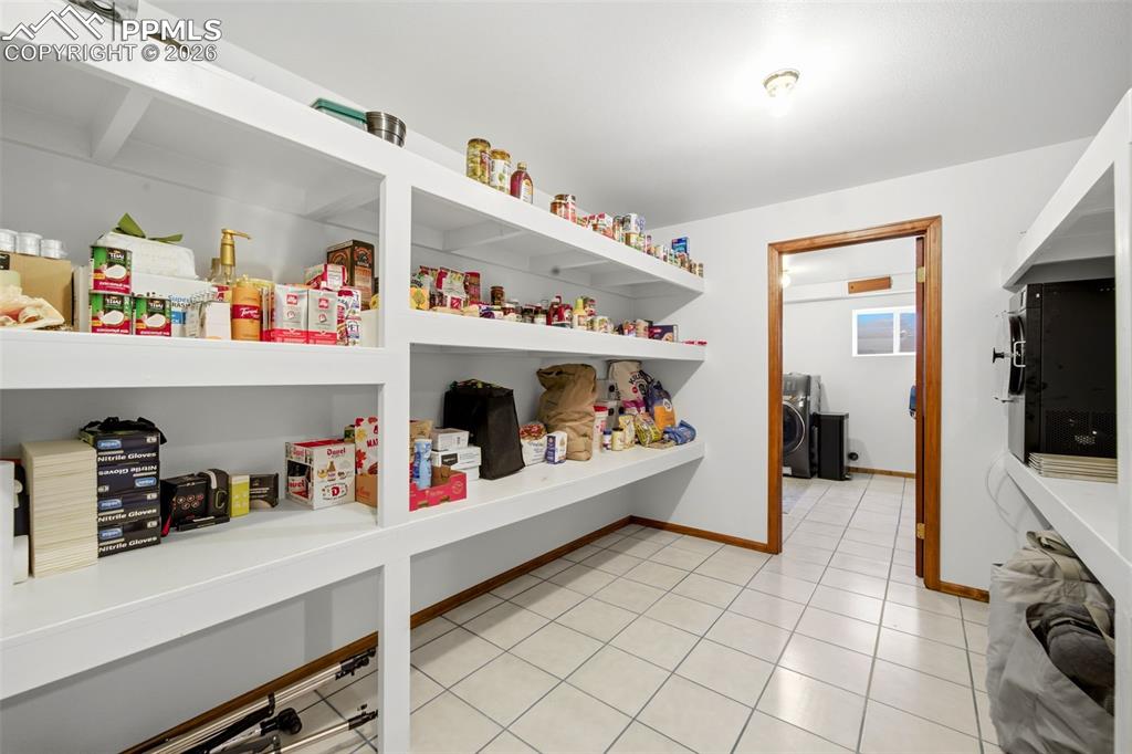 Pantry featuring washer / dryer