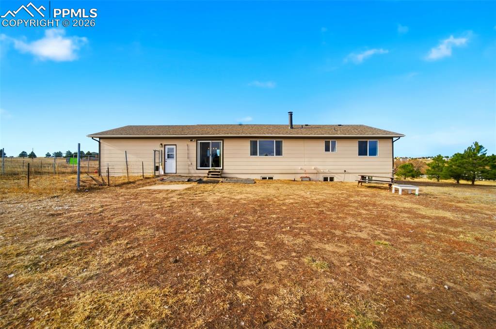 Back of property with a patio