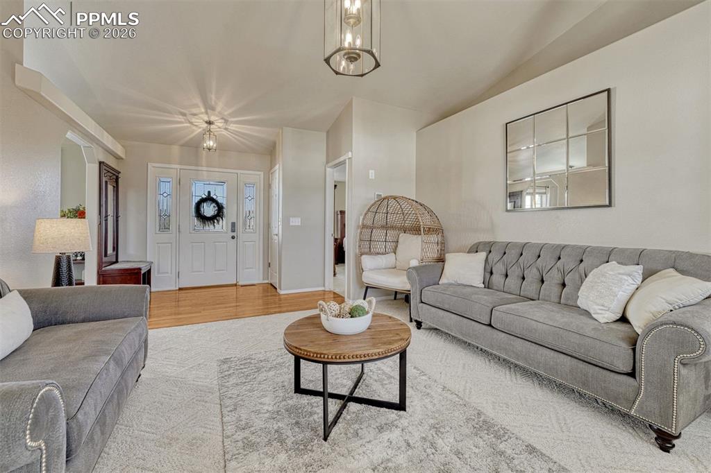 The living room is gracious and welcoming with it's soft neutral palette and plush sculpted carpeting