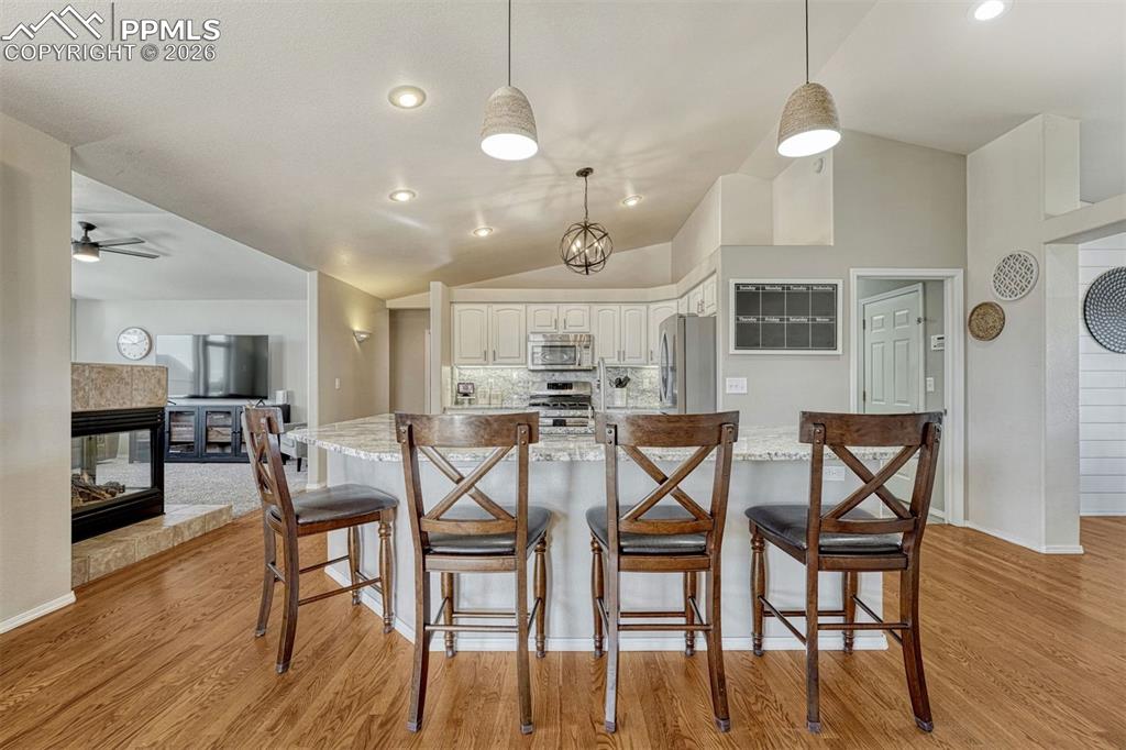 Bright and open, the kitchen features updated finishes and thoughtful conveniences that make it a natural gathering spot at the heart of the home