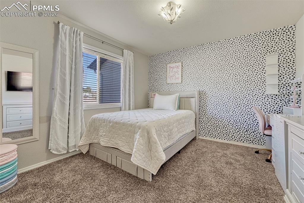 Bedroom 2 on the main level with double closet and plush carpet