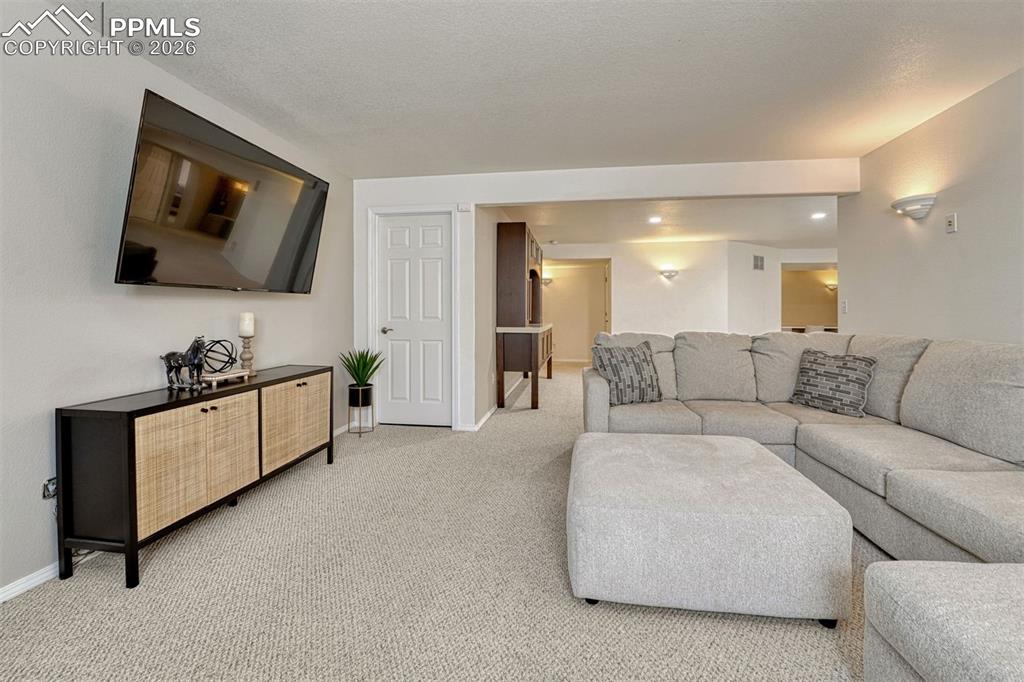 While storage is abundant throughout the home, the understairs area offers additional crawl-space access—ideal for stowing those less frequently used items