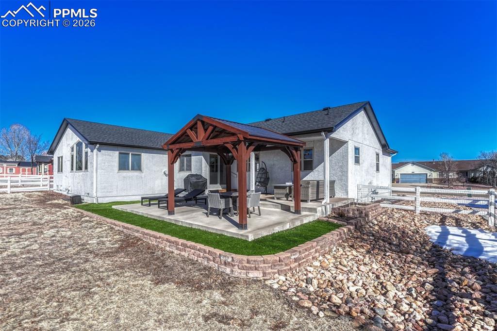 The back yard is fully fenced