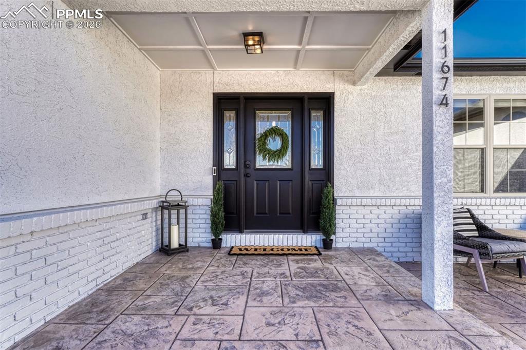 The charming covered porch is ideal for Colorado’s ever-changing weather, offering protection and comfort through sunshine, snow, and everything in between