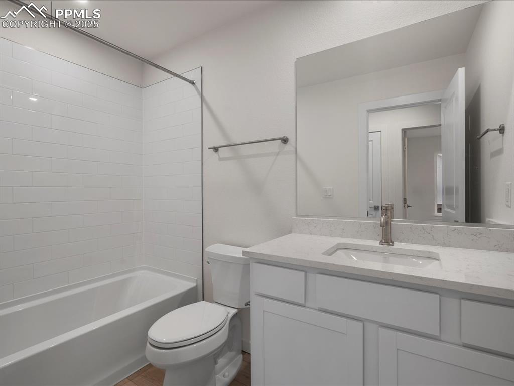 Bathroom featuring vanity and shower / tub combination
